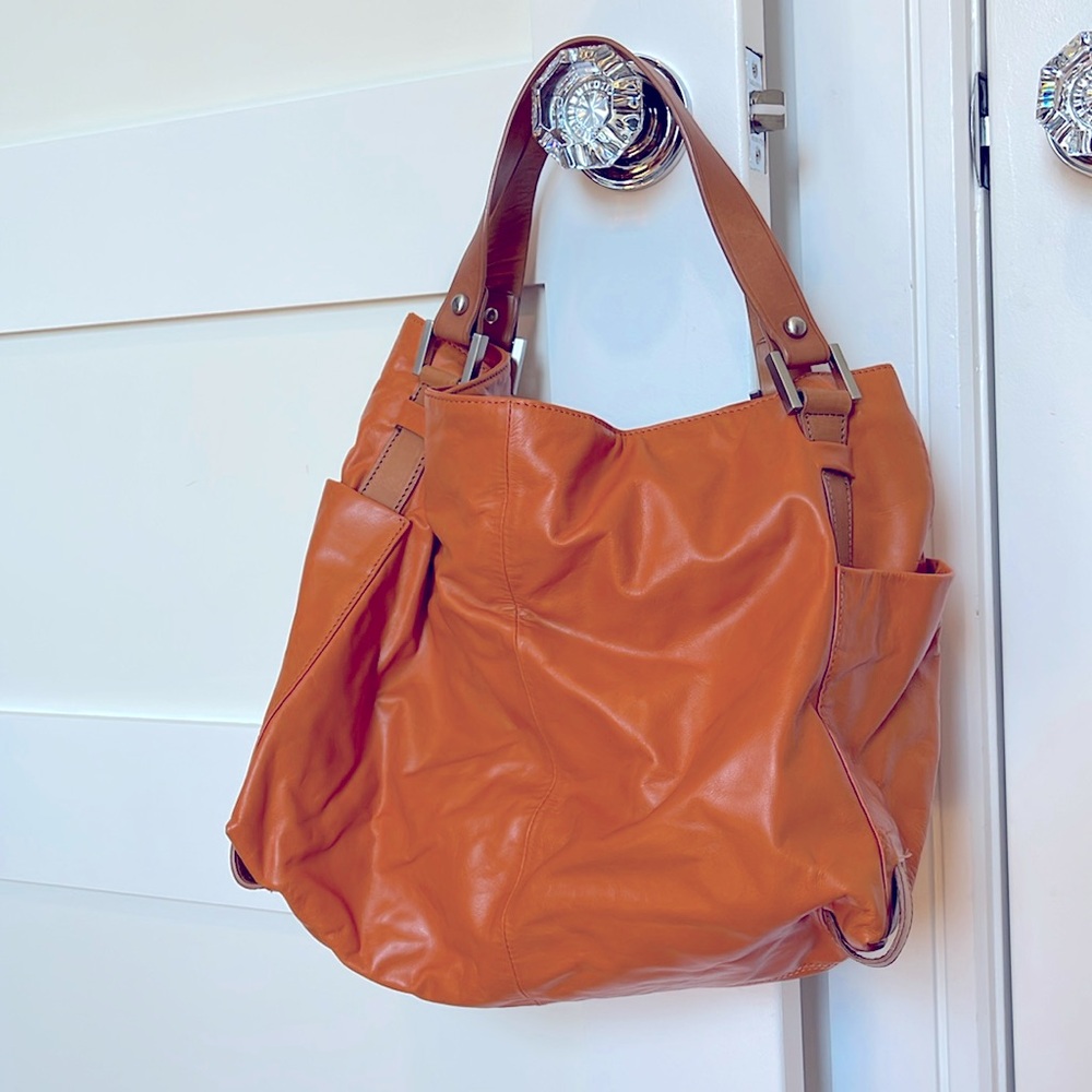 Kenneth Cole New York handbag. Orange and Tan. Soft leather.
